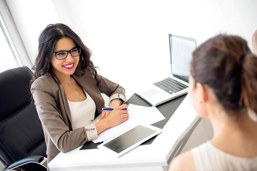 woman smiling at an interview