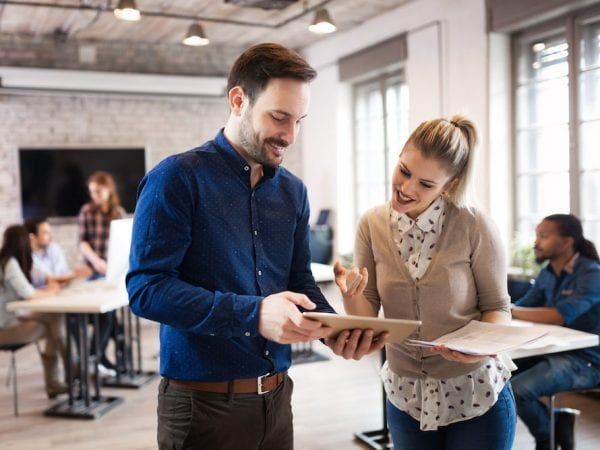 Portrait of young architects discussing in office